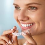 The Invisalign clear teeth-straightening system can restore a more natural bite pattern at Hebron Smiles in Carrollton